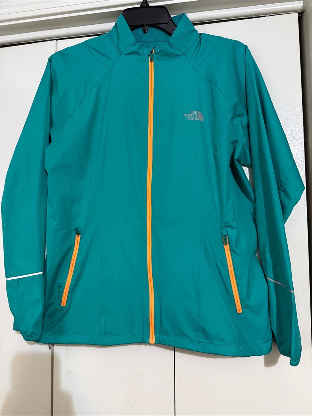 The North Face Girls' Teal Rain Jacket with Yellow Zippers